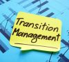 Klebezettel mit der Aufschrift Transition Management klebt auf Statistiken
